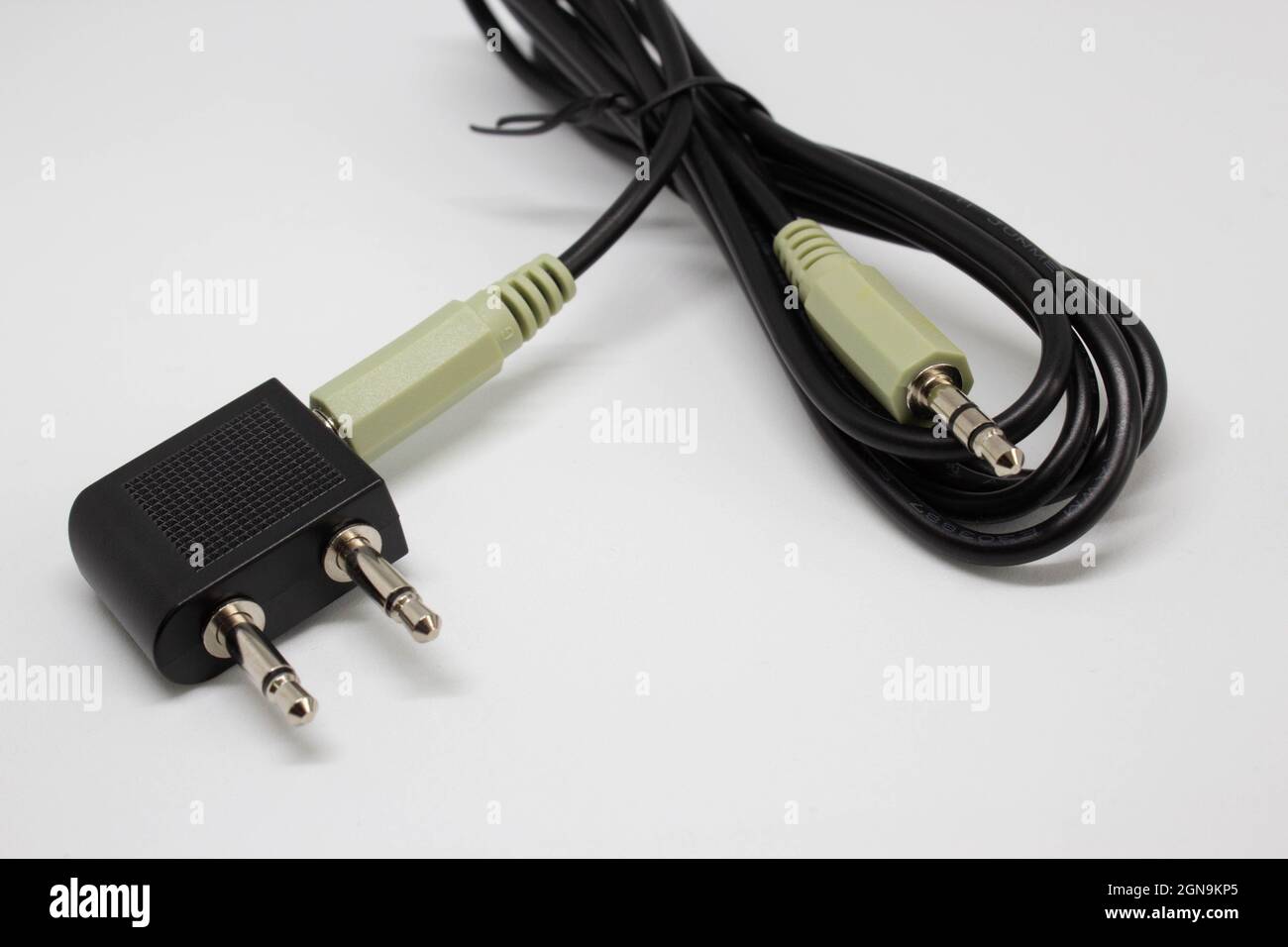 Aux cable with converter attachment. Headphones and microphone part. Connecter adapter. Aux