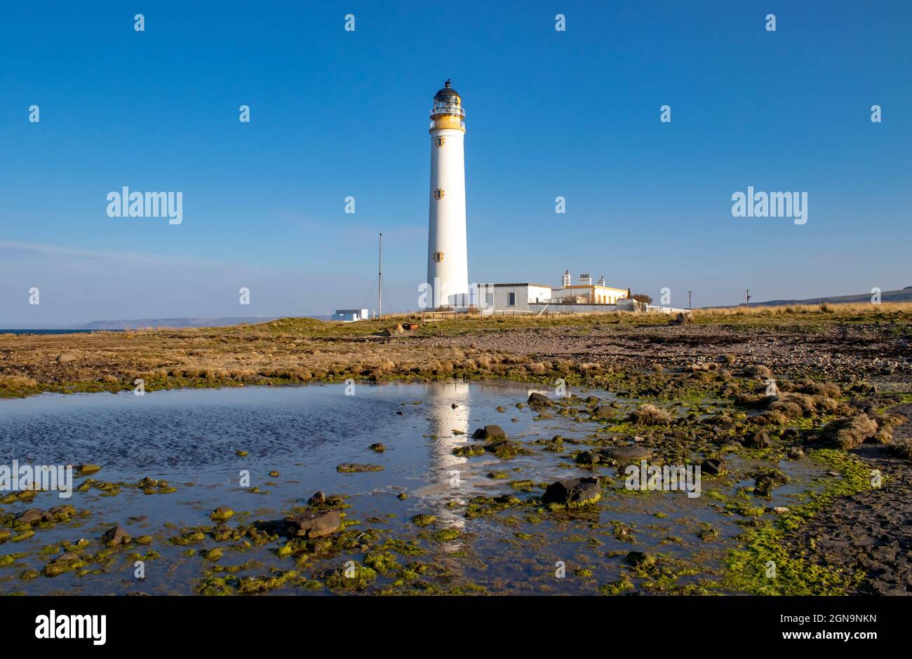 Barns Ness Lighthouse near Dunbar, Scotland, with Reflection Stock Photo