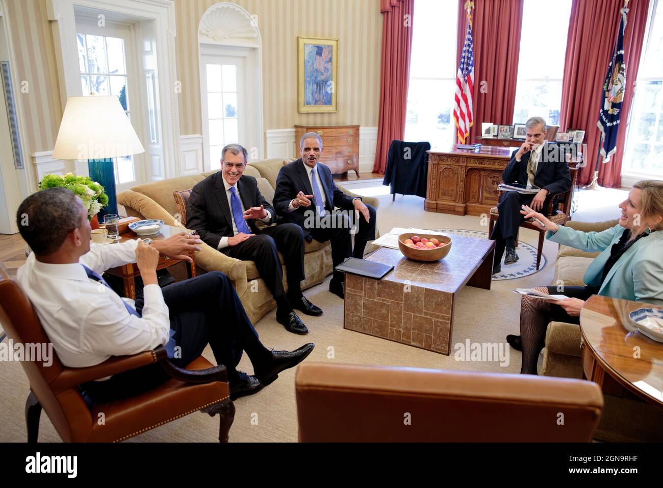 President Barack Obama meets with Solicitor General Donald Verrilli, left, and Attorney General Eric Holder in the Oval Office, Feb 21, 2013. Chief of Staff Denis McDonough and Kathryn Ruemmler, Counsel to the President, join them. (Official White House Photo by Pete Souza) This official White House photograph is being made available only for publication by news organizations and/or for personal use printing by the subject(s) of the photograph. The photograph may not be manipulated in any way and may not be used in commercial or political materials, advertisements, emails, products, promotions Stock Photo