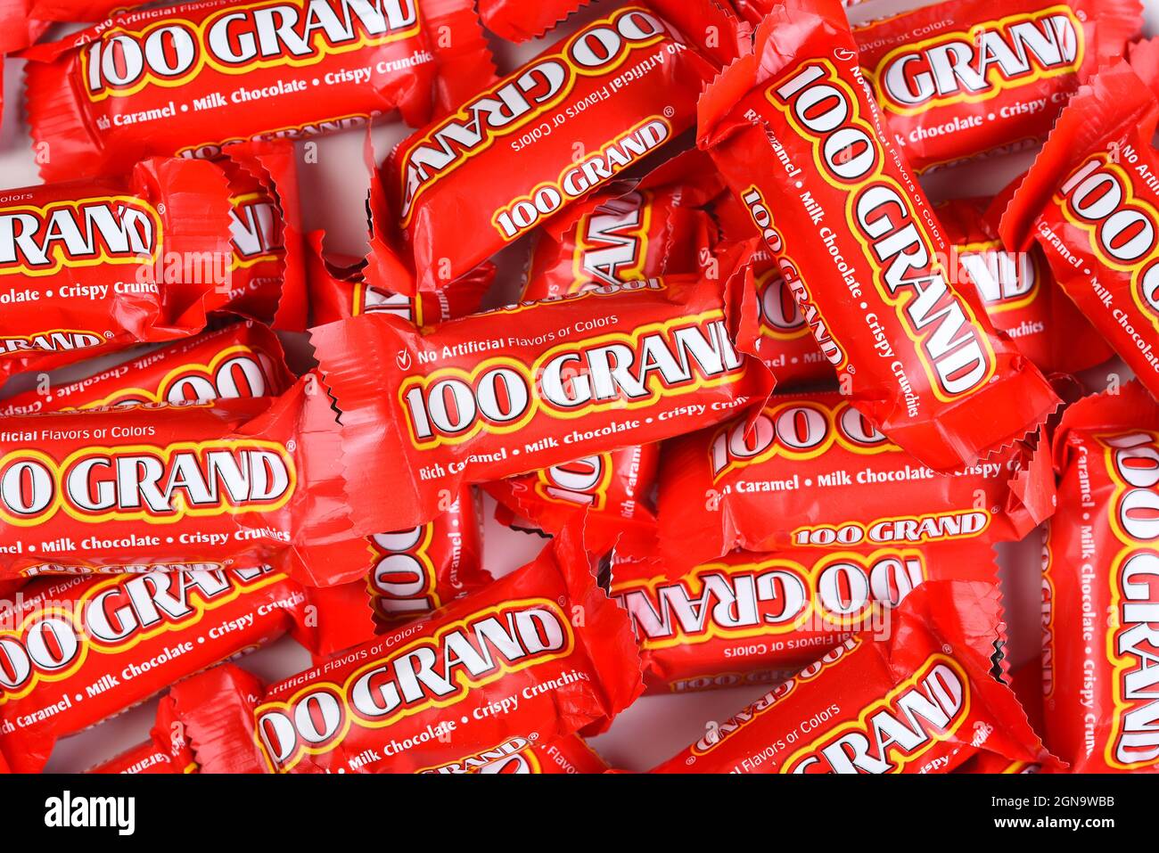 IRVINE, CALIFORNIA - 23 SEPT 2021: A large pile of 100 Grand Fun Size Candy Bars for Halloween. Stock Photo