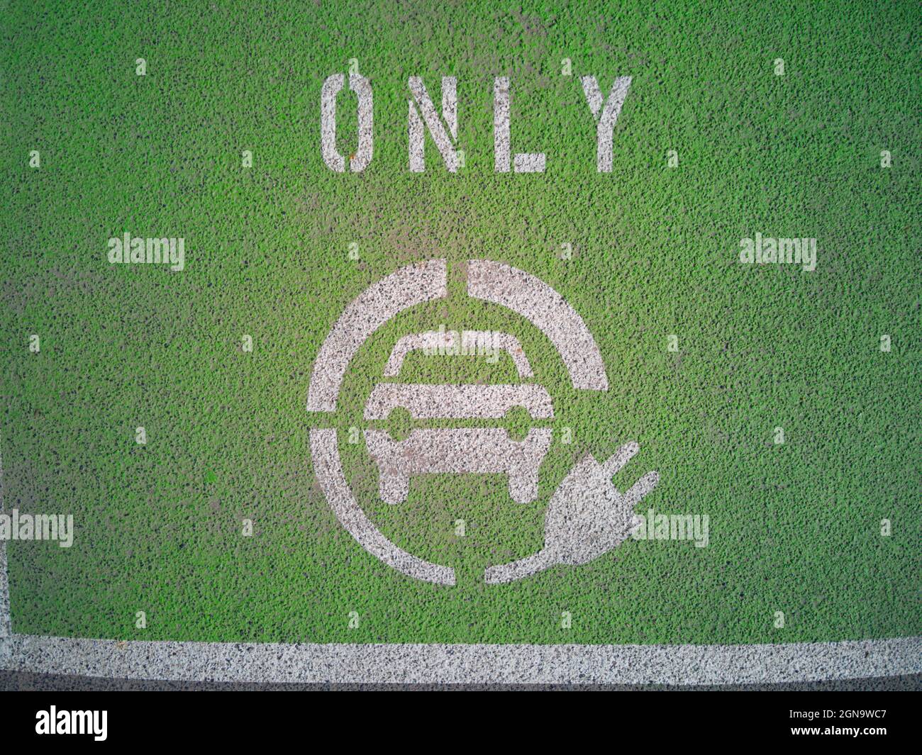 Electric car charging symbol with green background, plug in vehicle