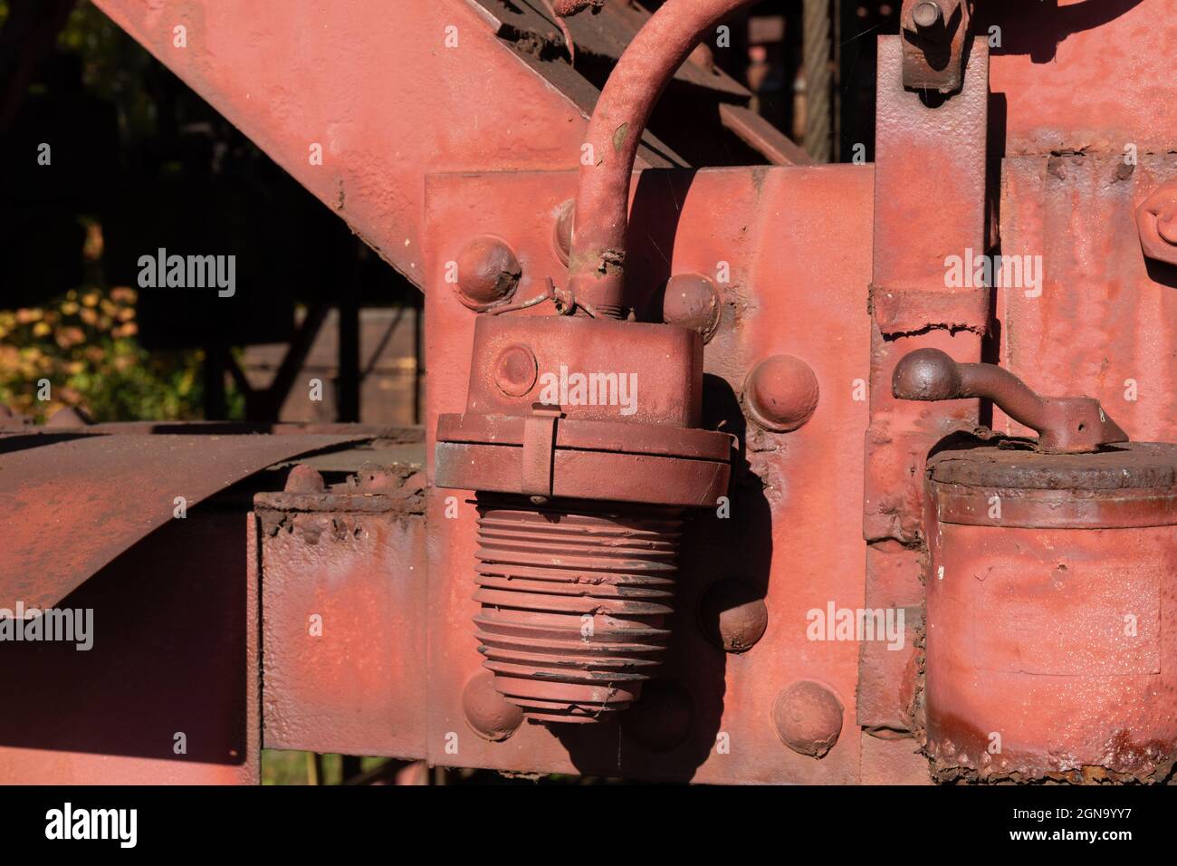Industrial structures painted red with rusting areas, metal objects, horizontal aspect Stock Photo
