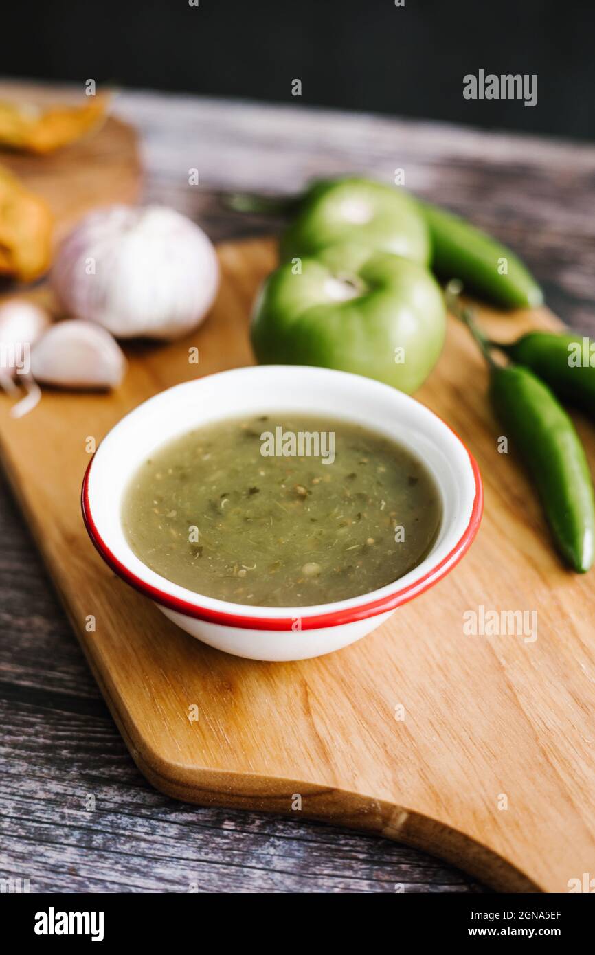 Mexican green sauce with chili peppers, green tomatoes and garlic in typical food of Mexico City Stock Photo