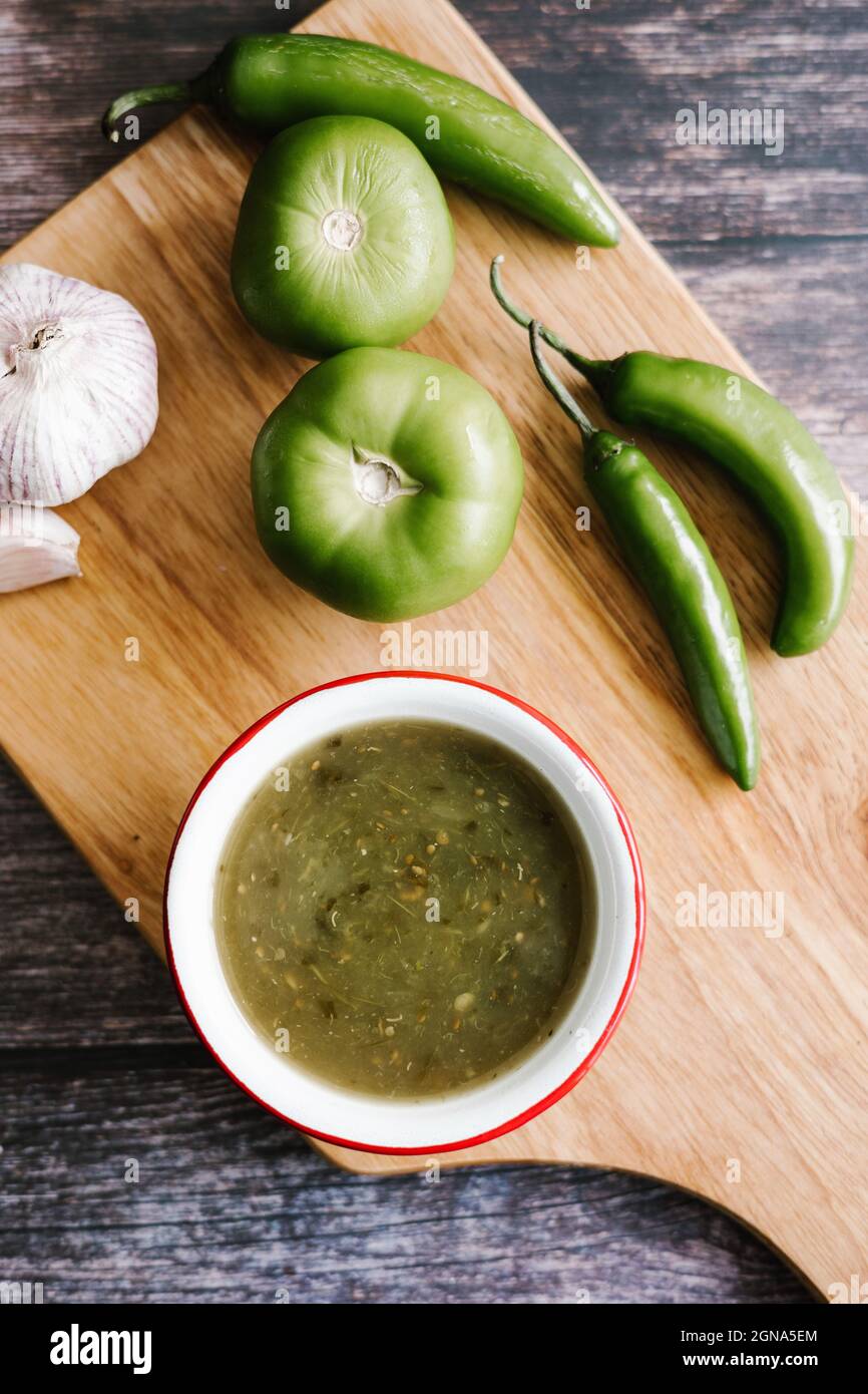 Mexican green sauce with ingredients for its preparation in mexican cuisine Stock Photo