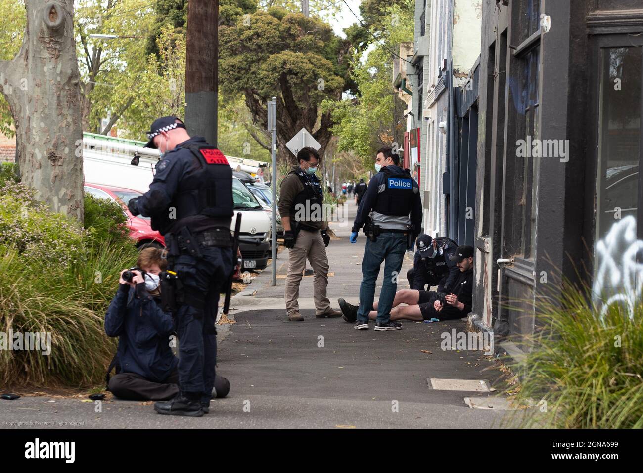 Melbourne, Australia. September 24 2021: Arrests continue in Melbourne as Police crack down on protest splinter groups, using air support to guide ground units in. Pictured here in Collingwood, VIC some protesters were pounced upon whilst running through residential streets as the city sees yet another day of anti-vaccine protests. Credit: Joshua Preston/Alamy Live News Stock Photo