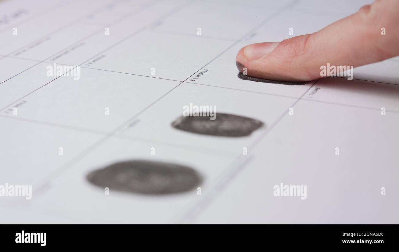 Close up macro of fingerprint registration form filling finger ink Stock Photo