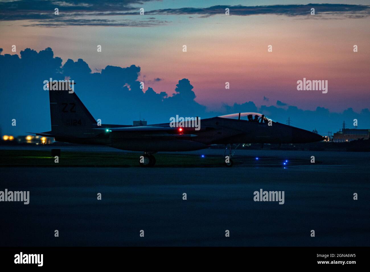 An F-15C Eagle assigned to the 44th Fighter Squadron awaits clearance to take off for a night flying training mission at Kadena Air Base, Japan, Sept. 22, 2021. Kadena Airmen regularly train to maintain their capability to provide unrivaled air power in support of U.S. Indo-Pacific Command objectives. (U.S. Air Force photo by Maj. Raymond Geoffroy) Stock Photo