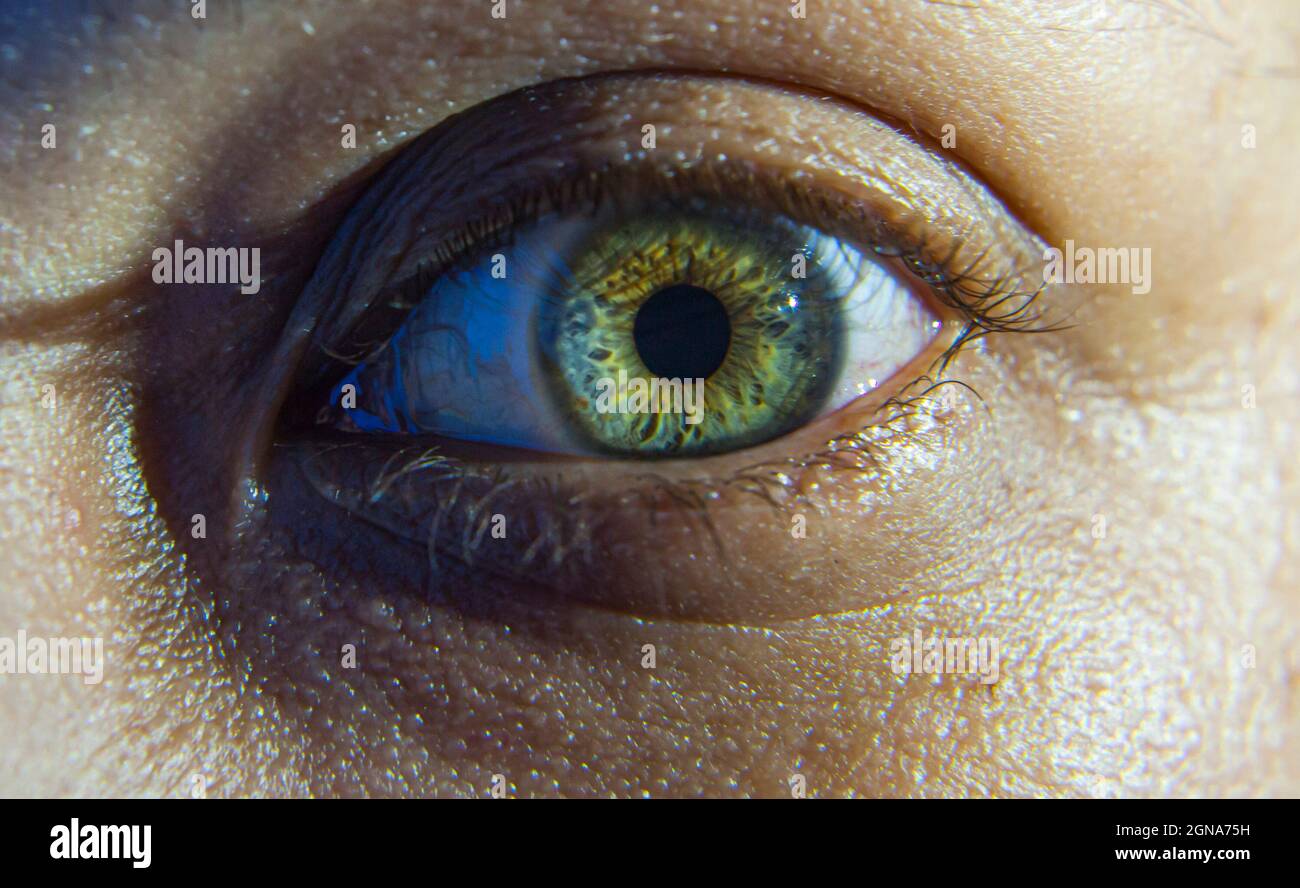 macro close up blue green eye, grungy, scary, gritty, dark Stock Photo