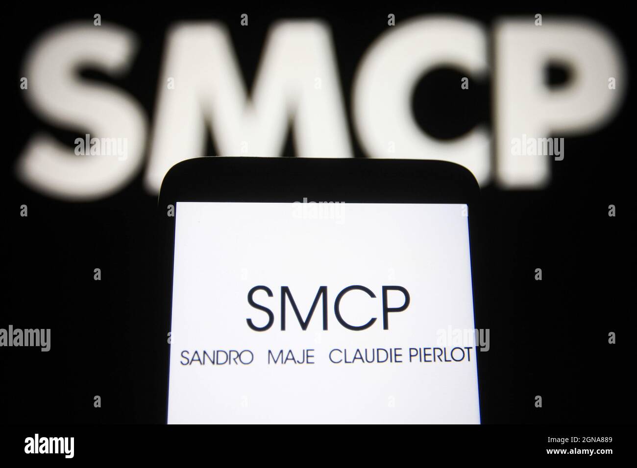 Ukraine. 23rd Sep, 2021. In this photo illustration a Groupe SMCP (Sandro,  Maje, Claudie Pierlot) logo is seen on a smartphone and a pc screen. (Photo  by Pavlo Gonchar/SOPA Images/Sipa USA) Credit: