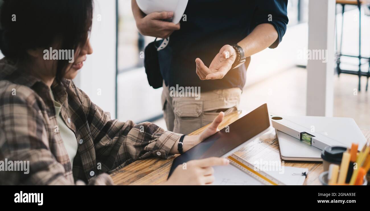 Engineer or architect doing model 3D the project on tablet with partner in offlice. Construction concept. Stock Photo
