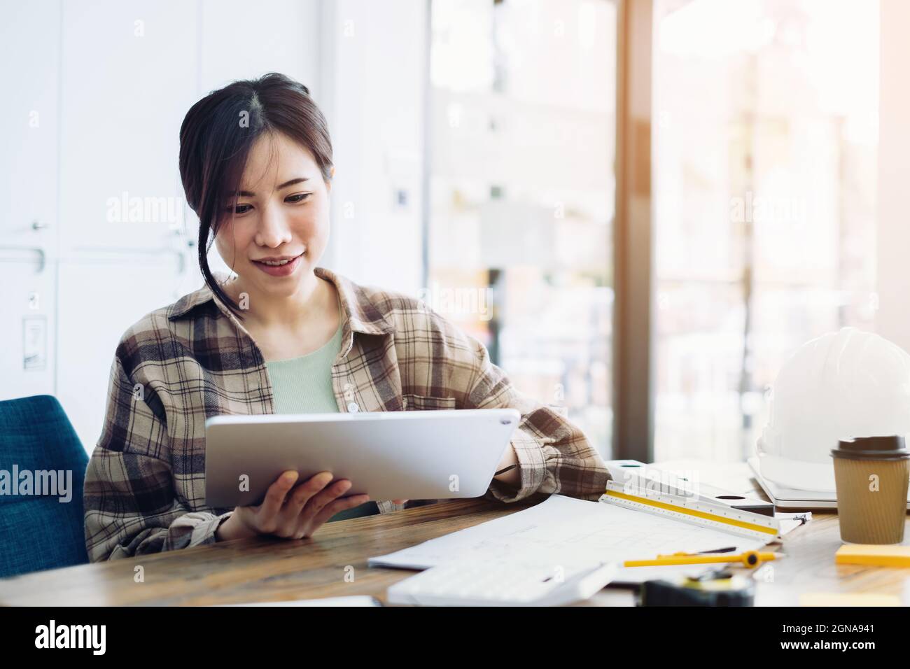 Engineer or architect doing the project model 3D on tablet. Construction concept. Stock Photo