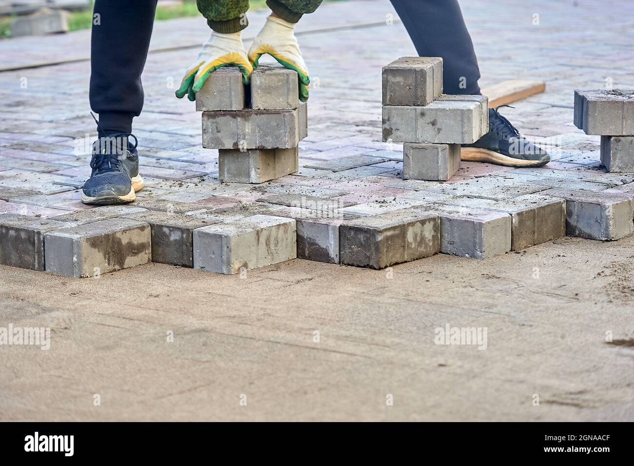 laying paving slabs on the sand with your hands Stock Photo Alamy