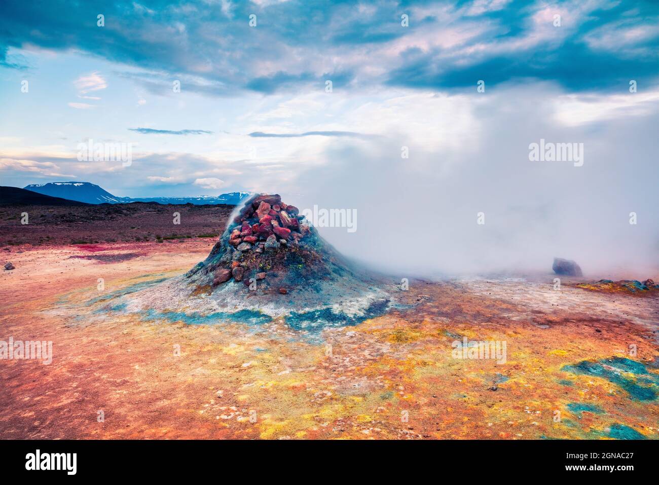 Steaming fumarole in geothermal valley Hverarond. Exotic summer landscape of volcanic Icelandic landmark, Reykjahlid village location, north Iceland, Stock Photo