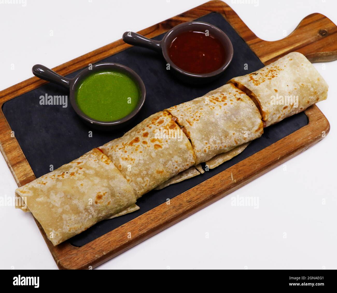 tandoori chicken tikka wrap sandwich served with mint and tamarind