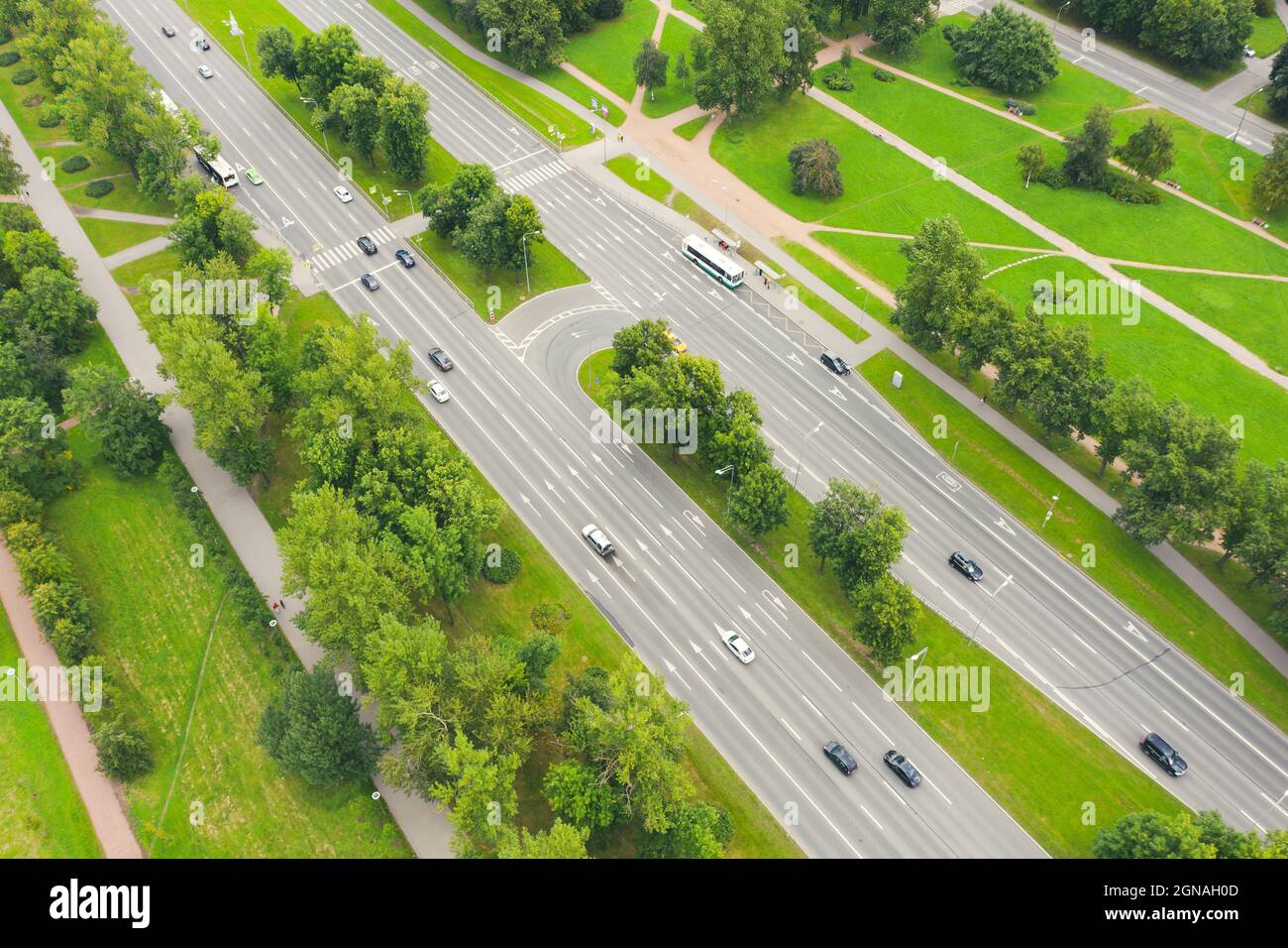 City road highway among the trees of the metropolis aerial view Stock ...