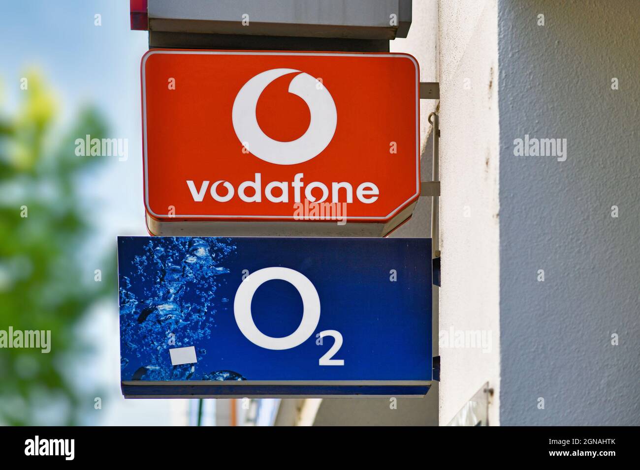 Karlsruhe, Germany - August 2021: Shop sign of  multinational telecommunications companies Vodafone and O2 Stock Photo