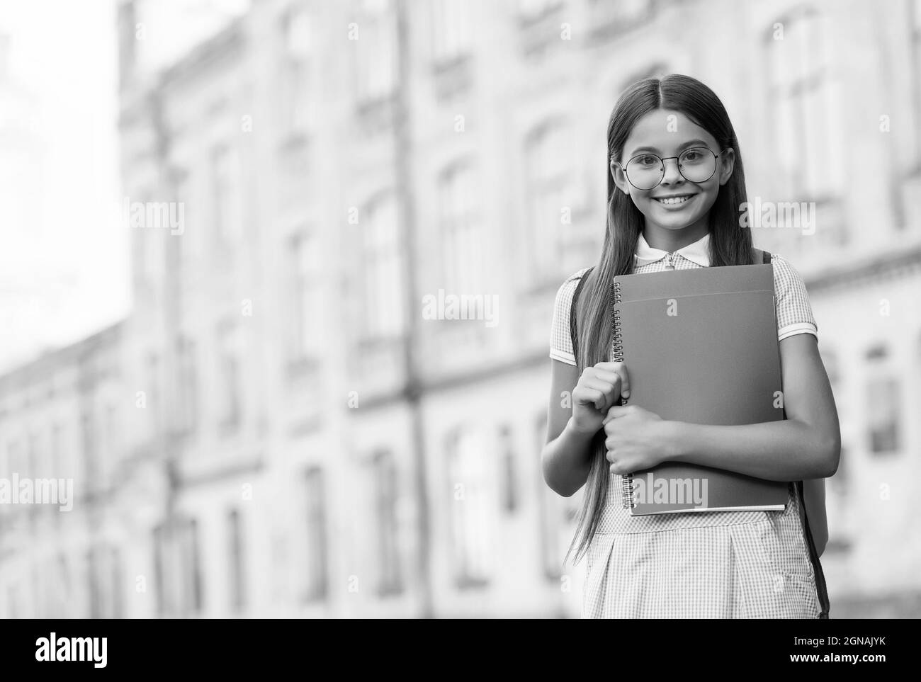 To succeed you must read. Happy child hold books. School library ...