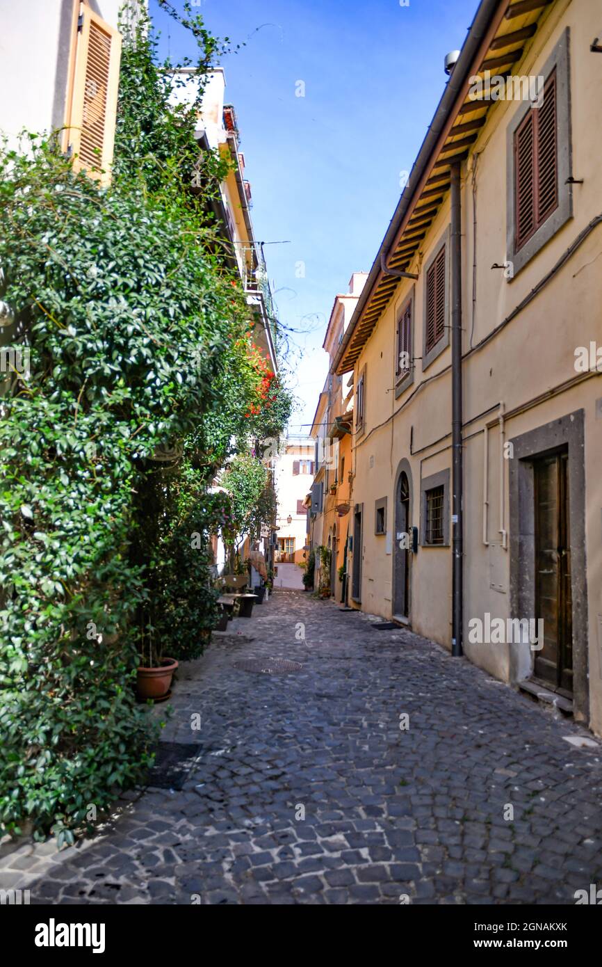 A narrow street in Castelgandolfo, a medieval town overlooking a lake in the province of Rome, Italy. Stock Photo
