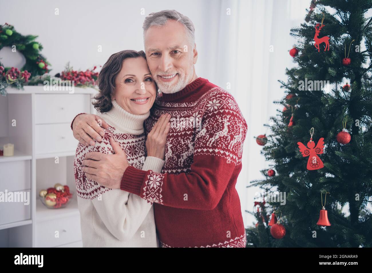 Photo of sweet couple old lady man hug wear sweater at home Stock Photo ...