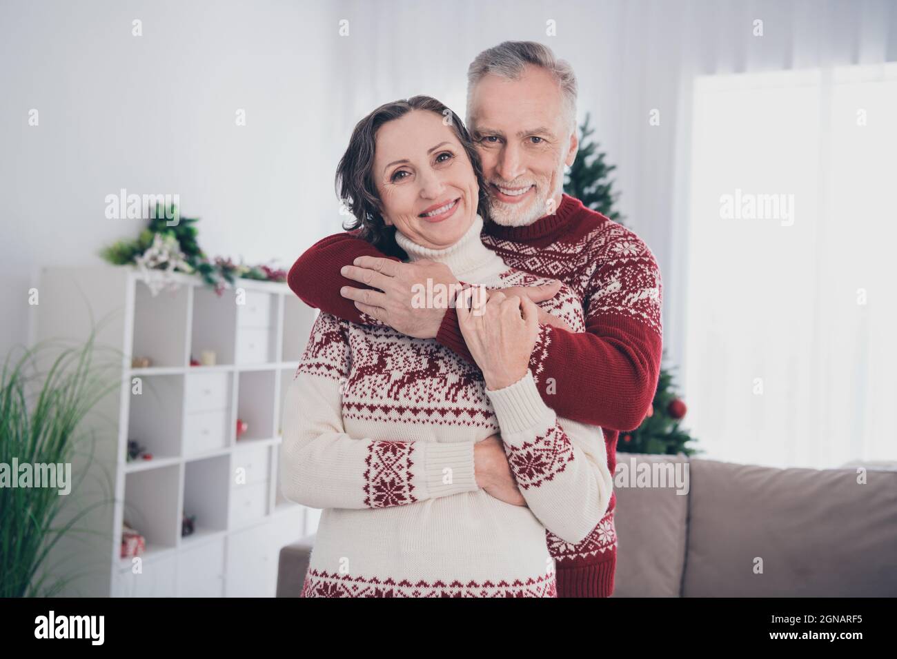 Photo of optimistic couple aged lady man hug wear sweater at home Stock ...