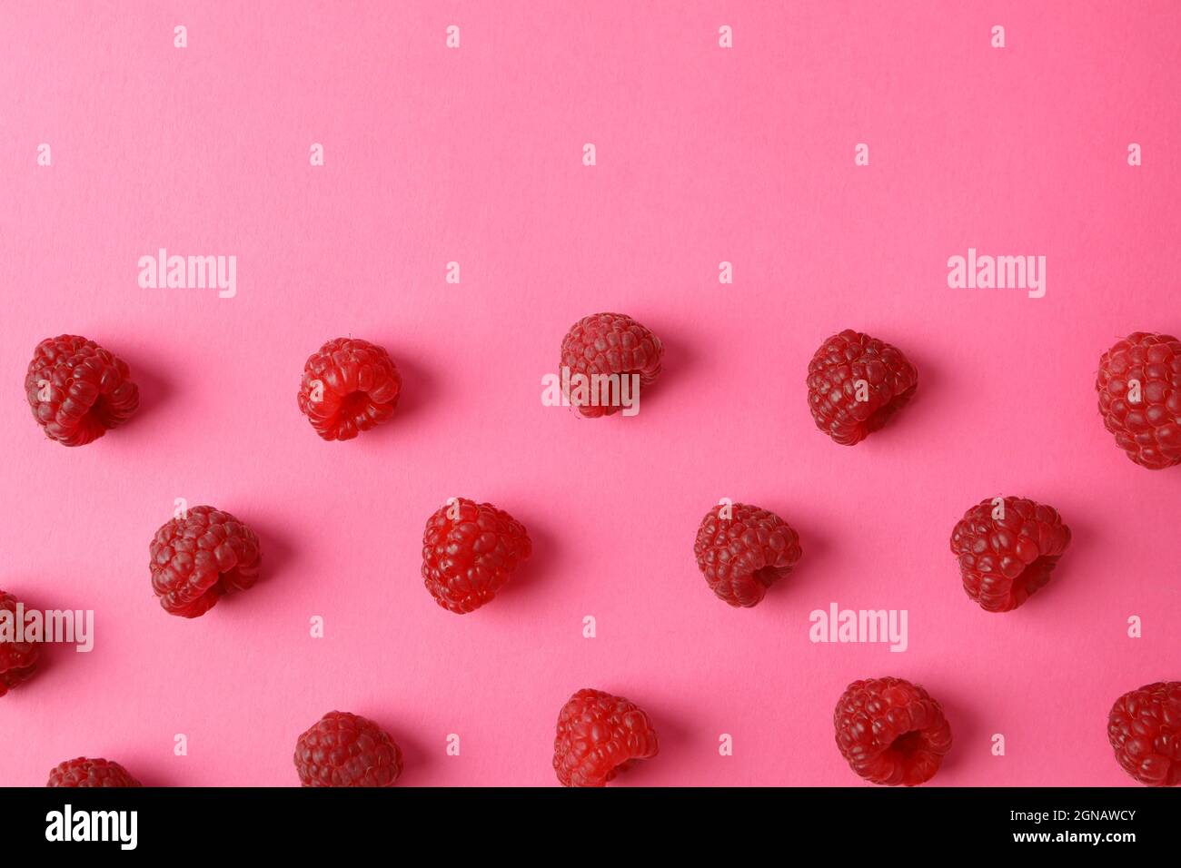Raspberry Flat Lay Flat lay composition with red juicy raspberries on a pink background ...