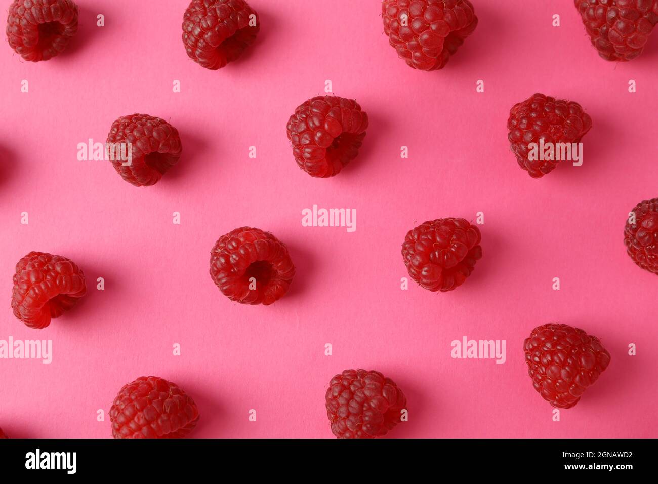 Raspberry Flat Lay Flat lay composition with red juicy raspberries on a pink background ...
