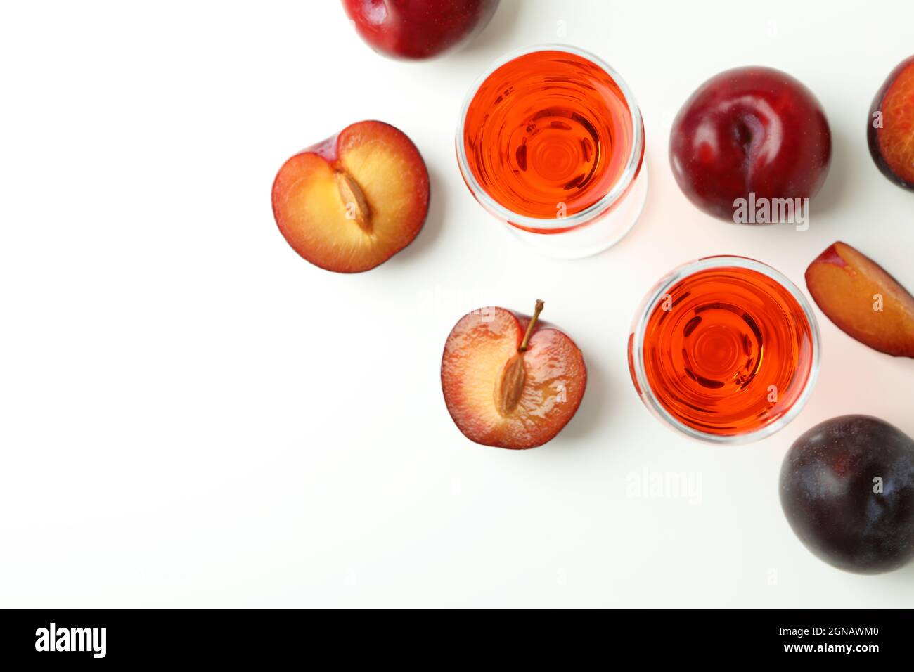 Plum brandy shots and ingredients on white background Stock Photo Alamy