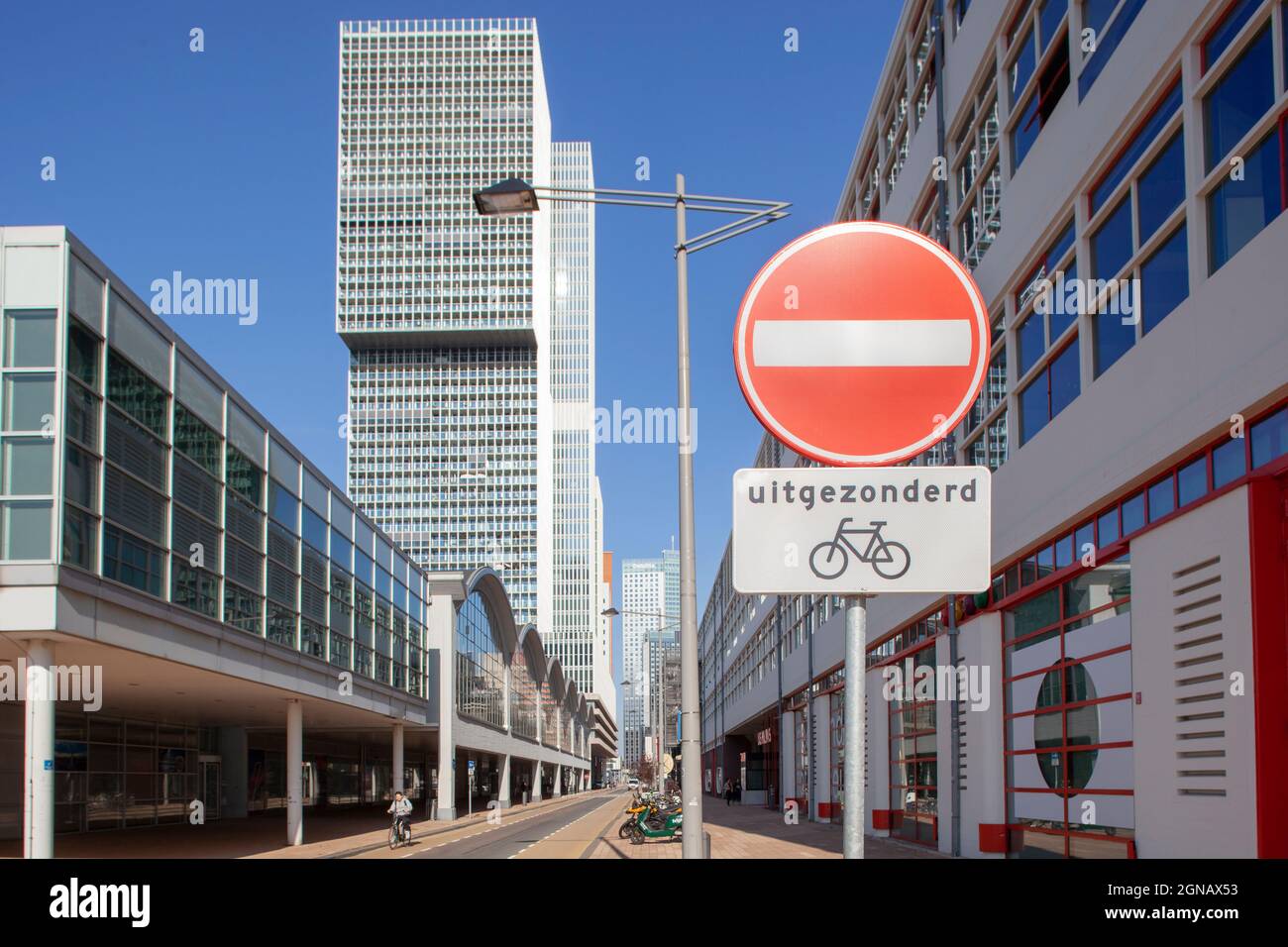 Rotterdam, Netherlands – September 22, 2021:  One way street except for bikes on the famous Wilhelminakade in Rotterdam with the photo museum on the r Stock Photo