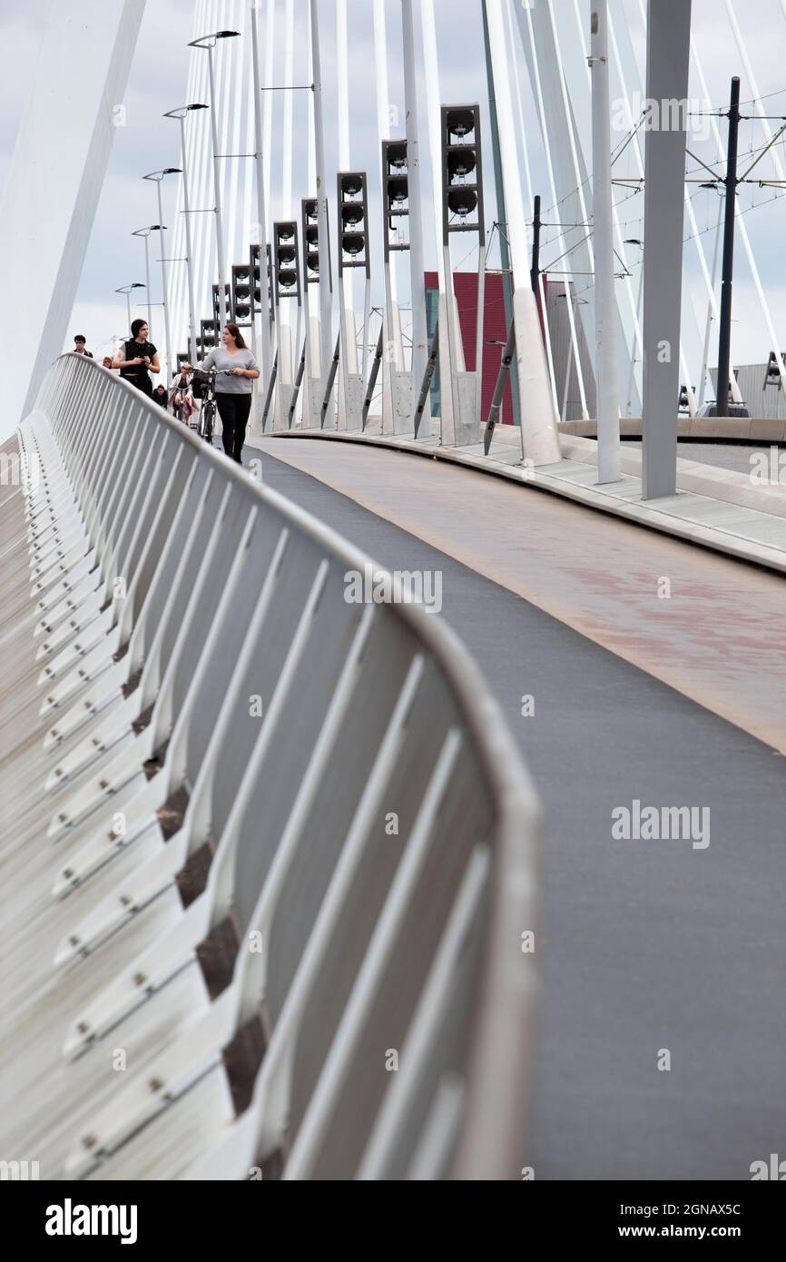 Rotterdam, Netherlands – September 13, 2021: : Pedestrians on the Erasmus bridge in Rotterdam Stock Photo