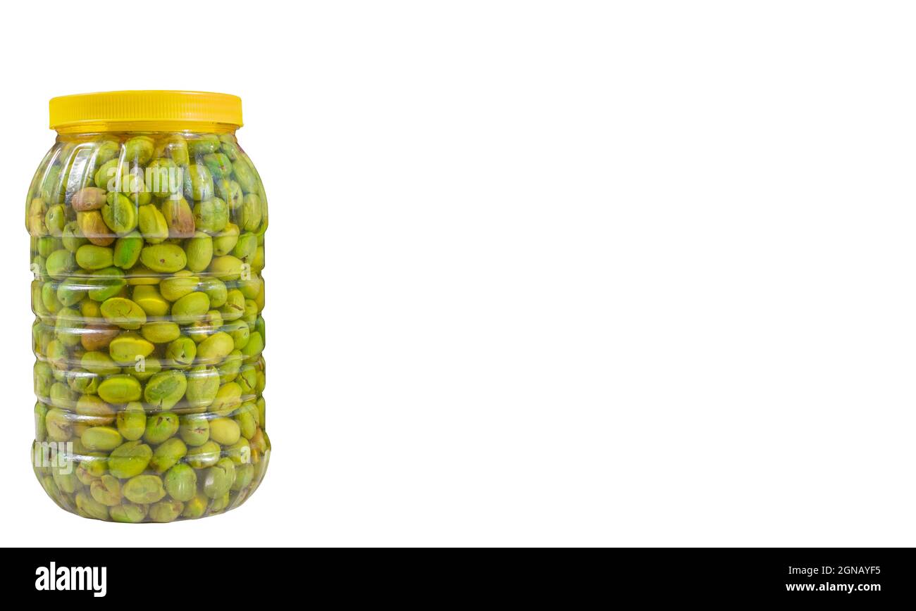 Copy space, pickled green olives. Brine green crushed olives in the