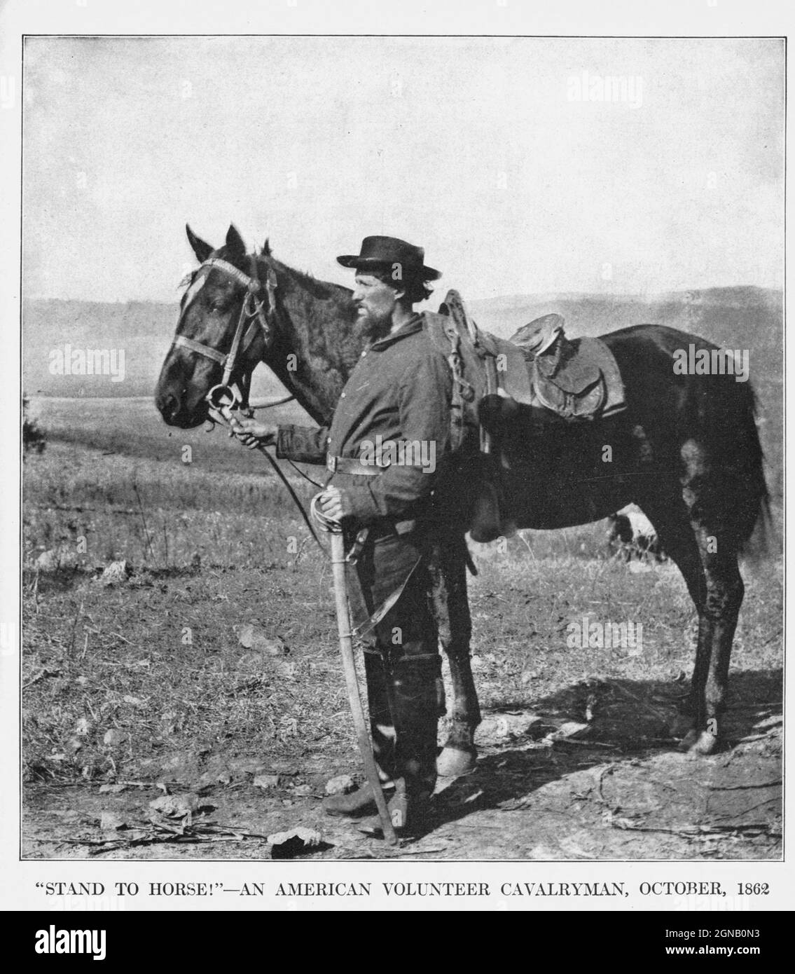 STAND TO HORSE! AN AMERICAN VOLUNTEER CAVALRYMAN, OCTOBER, 1862 from the book ' The Civil war through the camera ' hundreds of vivid photographs actually taken in Civil war times, sixteen reproductions in color of famous war paintings. The new text history by Henry W. Elson. A. complete illustrated history of the Civil war Stock Photo