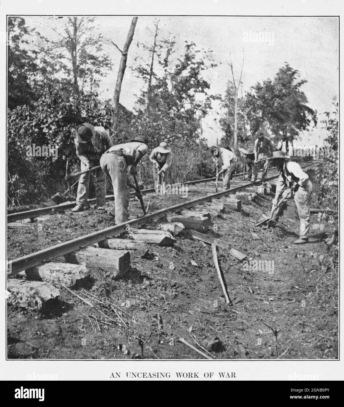 Contraband laborers [Escaped Slaves] often pressed into service by Federals are repairing the &quot;stringer&quot; track near Murfreesboro after the battle of Stone s River. from the book ' The Civil war through the camera ' hundreds of vivid photographs actually taken in Civil war times, sixteen reproductions in color of famous war paintings. The new text history by Henry W. Elson. A. complete illustrated history of the Civil war Stock Photo