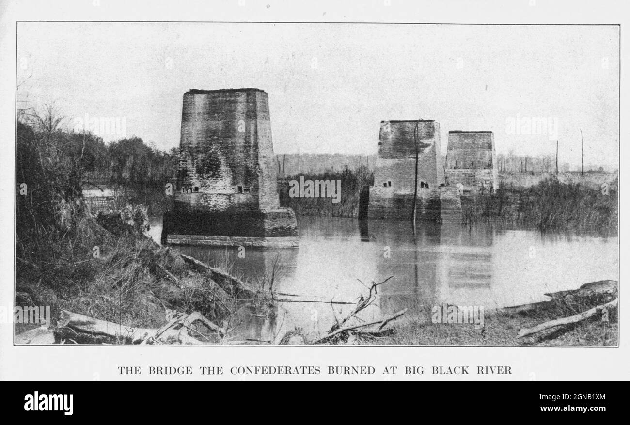 the Big Black River Bridge burnt by the retreating Confederates. from the book ' The Civil war through the camera ' hundreds of vivid photographs actually taken in Civil war times, sixteen reproductions in color of famous war paintings. The new text history by Henry W. Elson. A. complete illustrated history of the Civil war Stock Photo