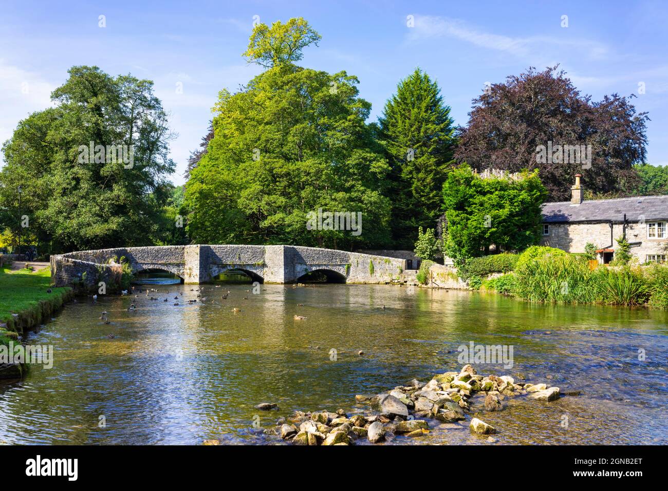 Medieval Sheepwash Bridge over the River Wye in the Village of Ashford in the Water, White Peak, Derbyshire  England UK GB Europe Stock Photo