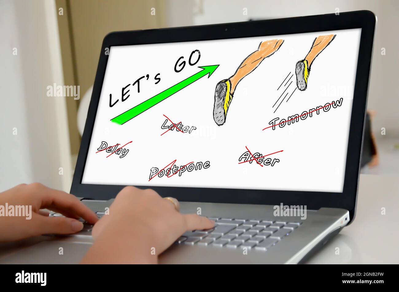 Hands on a laptop with screen showing action concept Stock Photo - Alamy