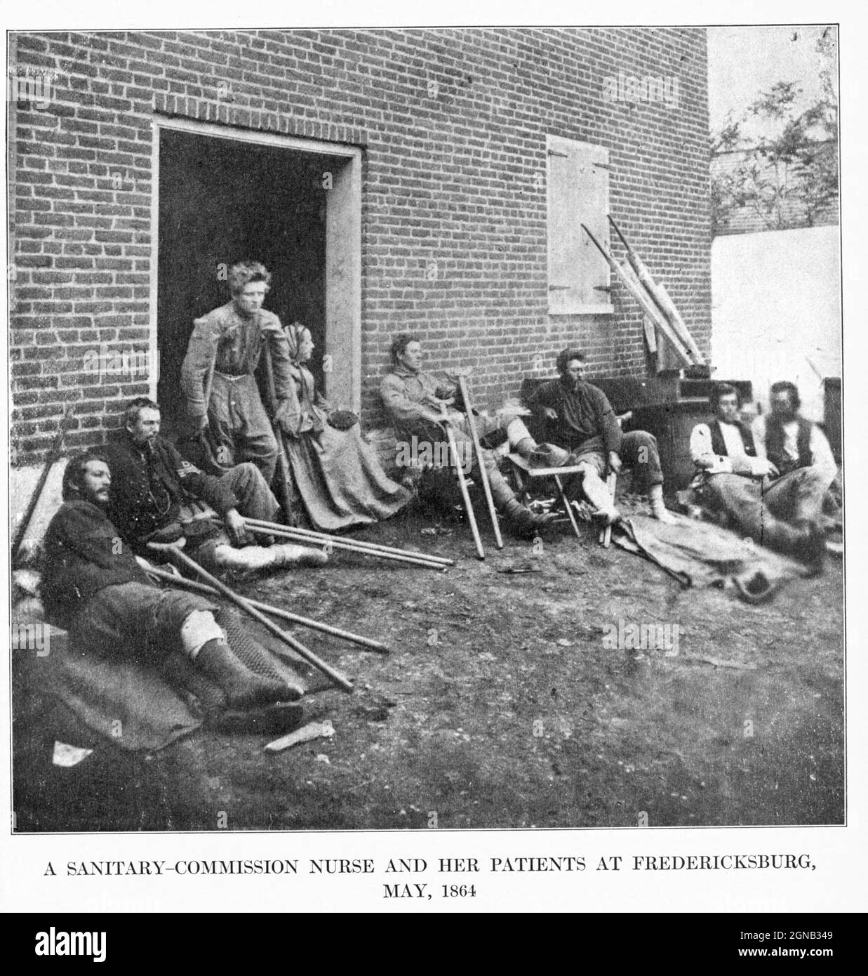 A SANITARY-COMMISSION NURSE AND HER PATIENTS AT FREDERICKSBURG, MAY, 1864 from the book ' The Civil war through the camera ' hundreds of vivid photographs actually taken in Civil war times, sixteen reproductions in color of famous war paintings. The new text history by Henry W. Elson. A. complete illustrated history of the Civil war Stock Photo