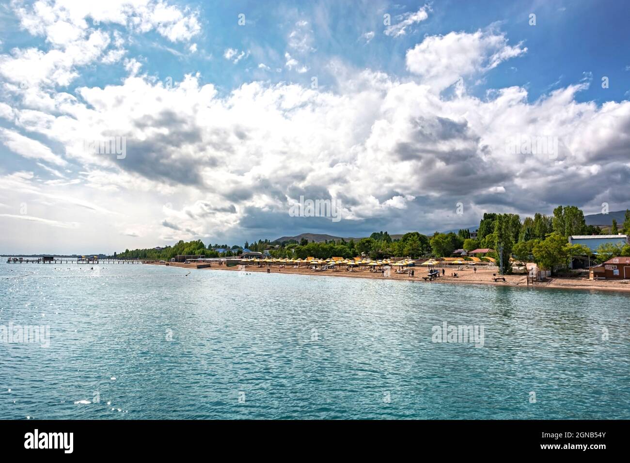 Idyllic Summer Setting Idyllic summer landscape with lake near mountain with reflection from ...