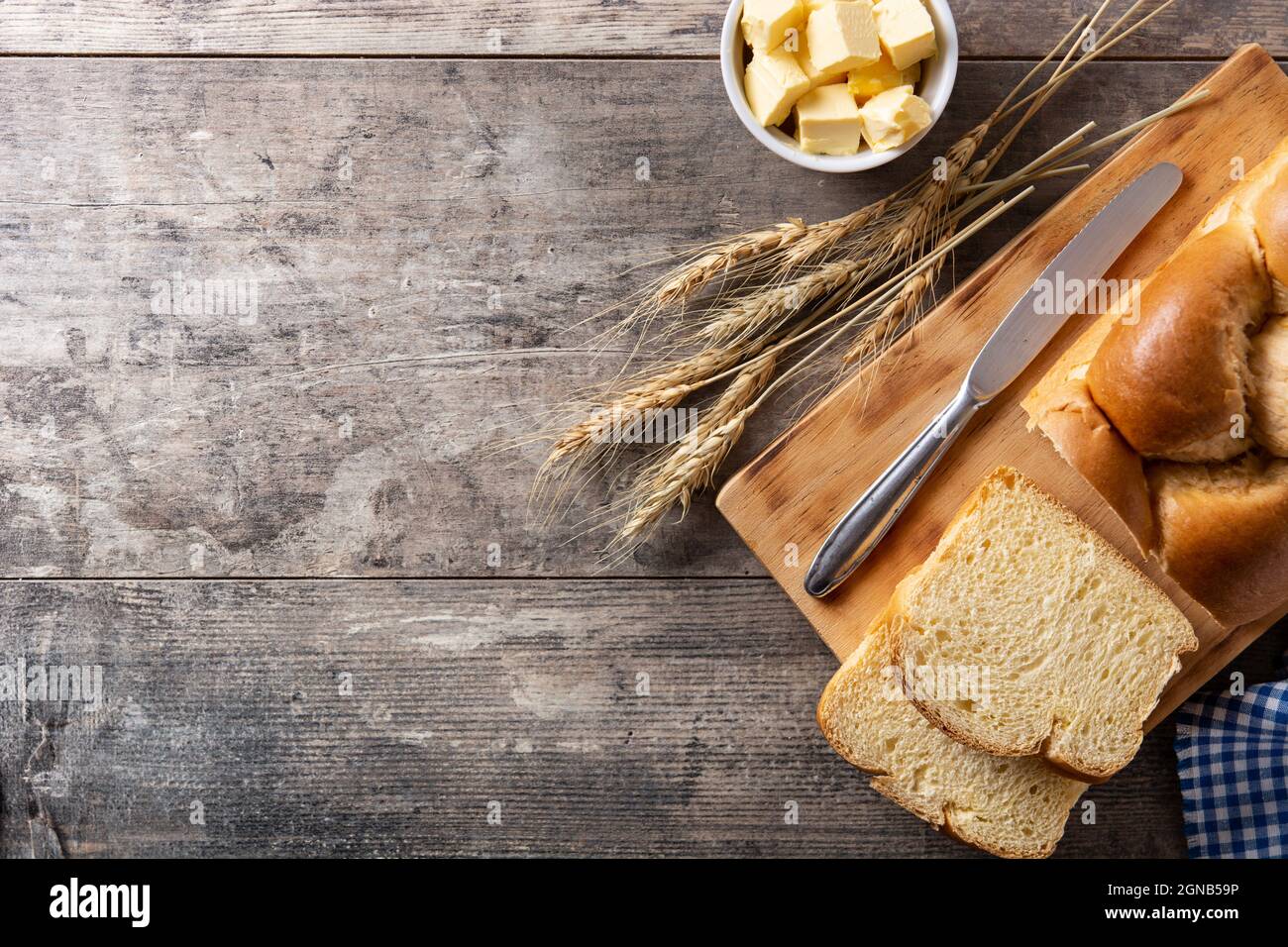 Braided egg bread on wooden table Stock Photo