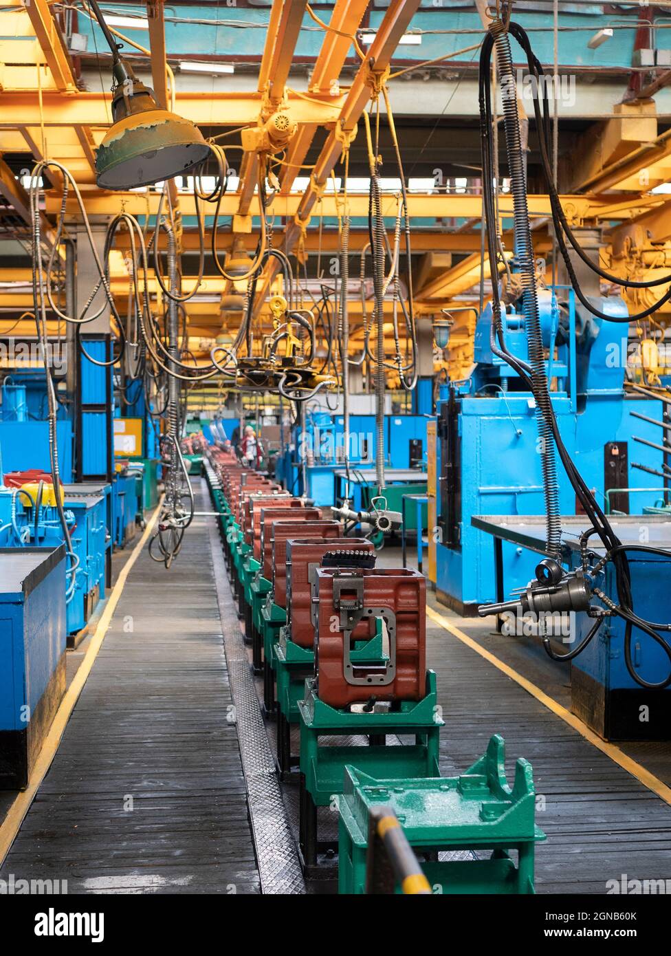 Transmission gearbox final assembly line at the tractor factory. Assembling shop interior. Tractor machinery components Stock Photo