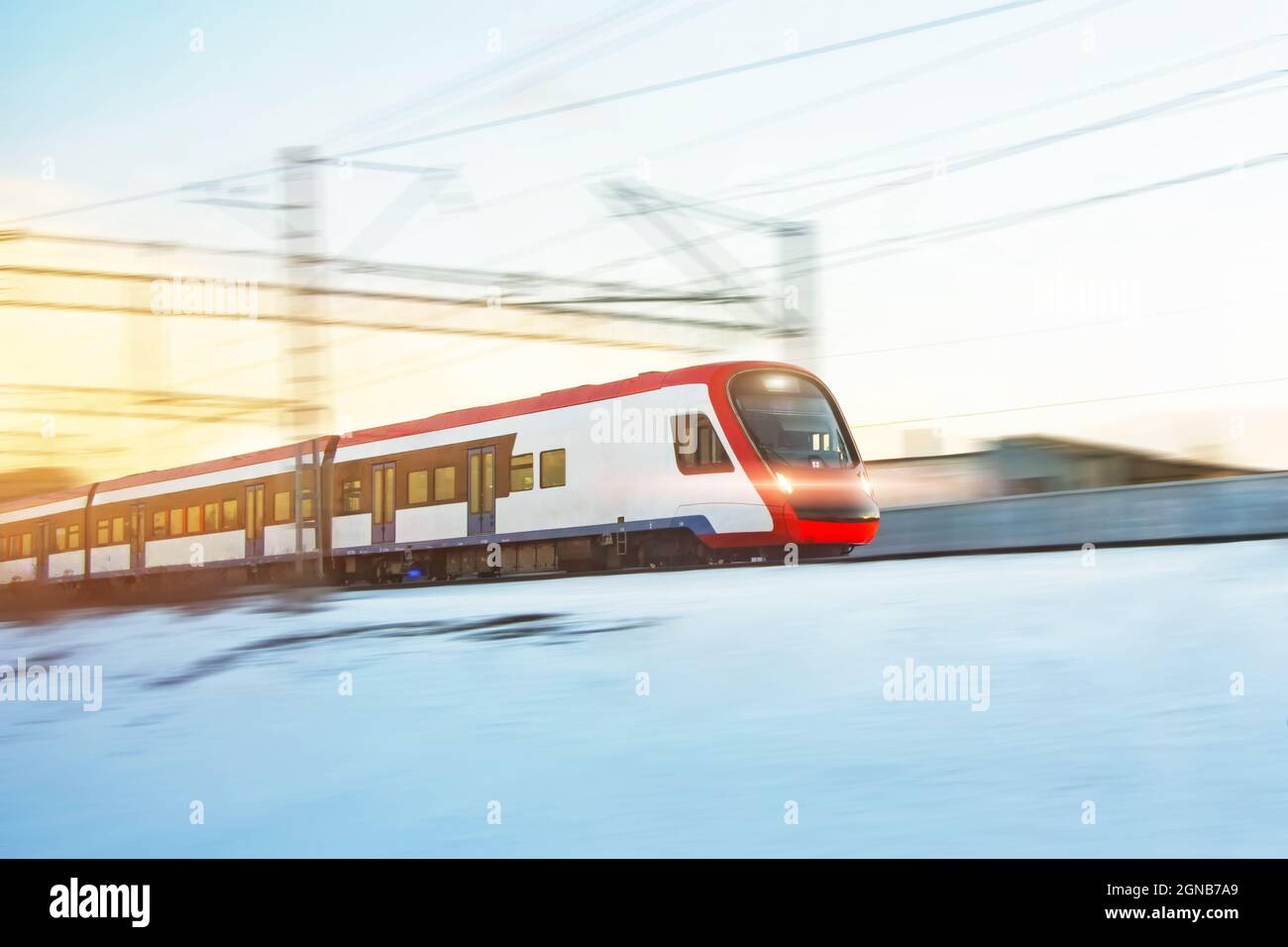 Rushing motion speed passenger train with headlights on Stock Photo - Alamy