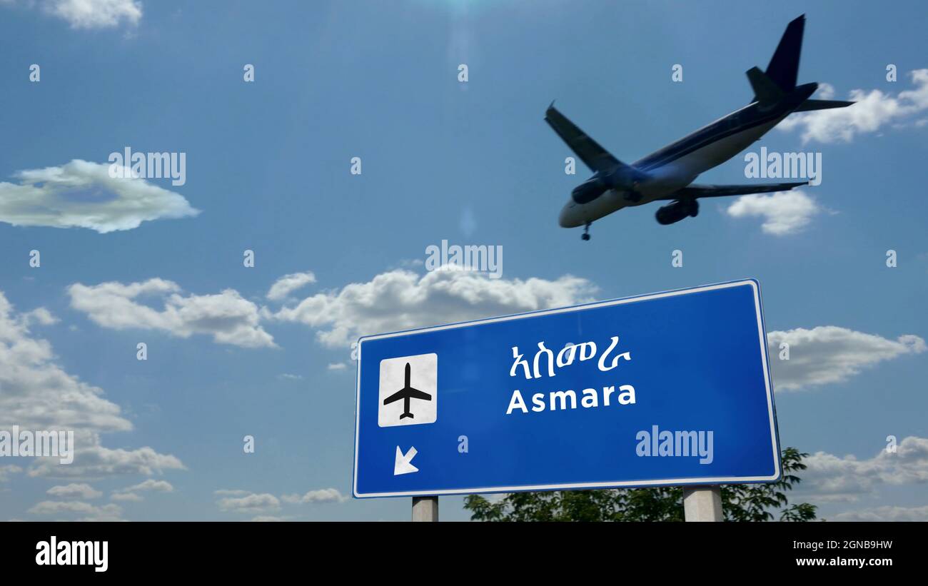 Airplane silhouette landing in Asmara, Eritrea. City arrival with international airport direction signboard and blue sky. Travel, trip and transport c Stock Photo