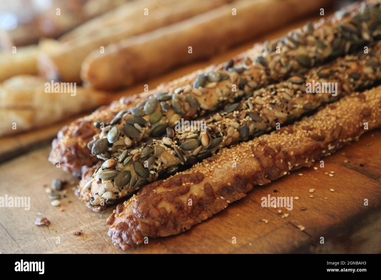 Breadsticks (grissini) selection of breadsticks topped with poppy seeds, sesame and herbs Stock Photo