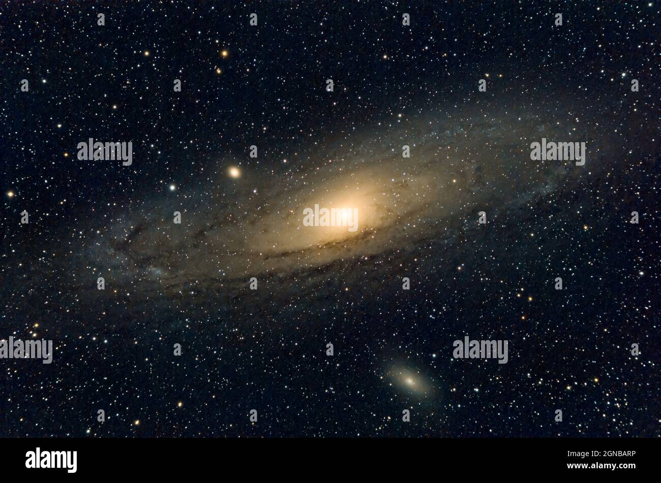 the Andromeda galaxy (Messier 31) with the satellite galaxies Messier 32 and Messier 110 photographed with an apochromatic refractor and a cooled came Stock Photo