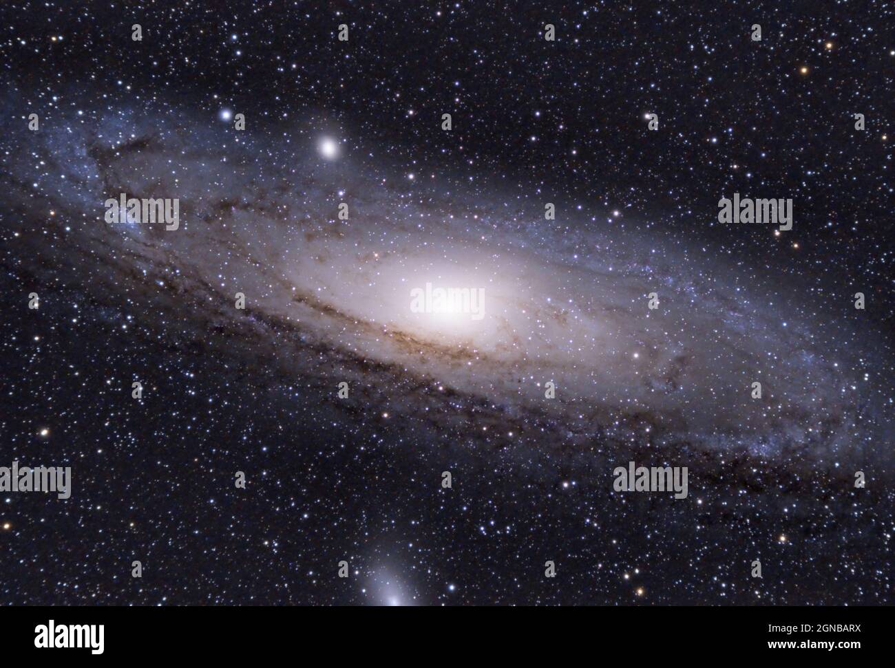 the Andromeda galaxy (Messier 31) with the satellite galaxies Messier 32 and Messier 110 photographed with an apochromatic refractor and a cooled came Stock Photo