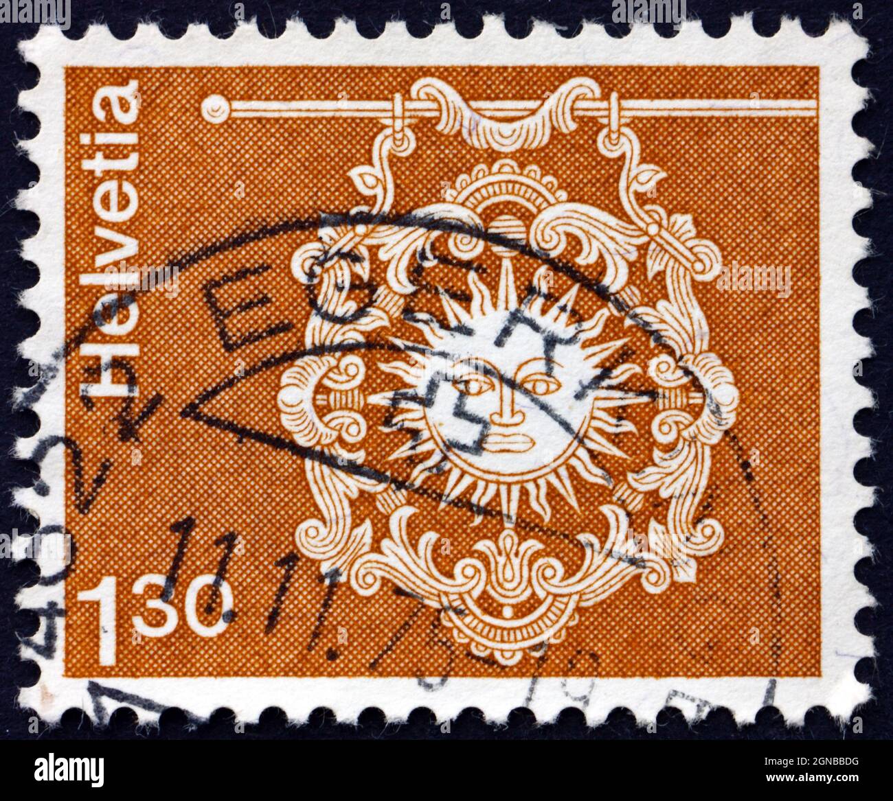 SWITZERLAND - CIRCA 1973: a stamp printed in the Switzerland shows Sign of Inn Zur Sonne, Toggenburg, circa 1973 Stock Photo