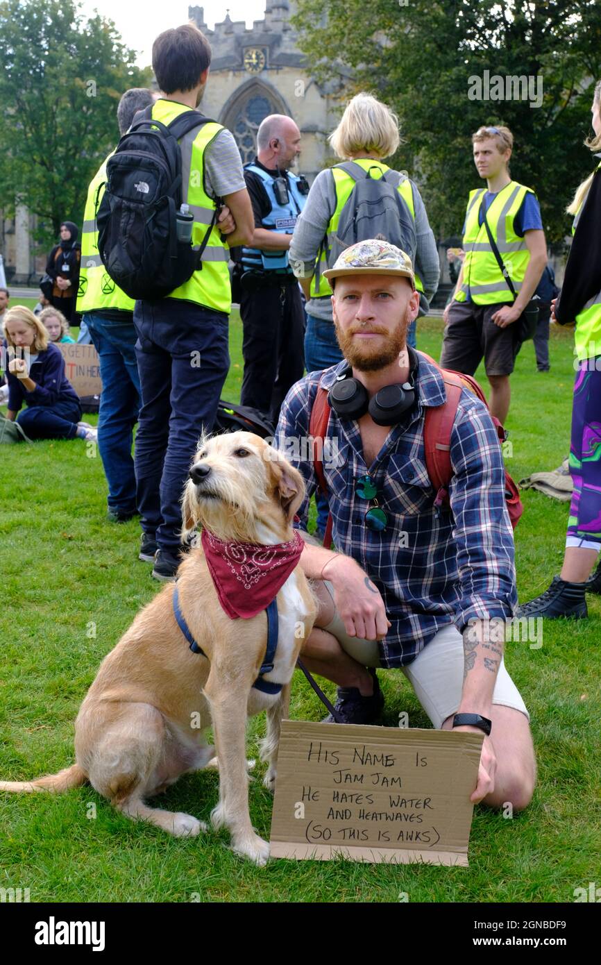 Bristol, UK. 24th Sep, 2021. Jam Jam the dog has a view on climate change. Many people and school age protestors gather on College Green to continue the protest against Government's lack of action over climate change. This will be the first public climate strike since Greta Thunberg visited the city in Feb 2020. Credit: JMF News/Alamy Live News Stock Photo