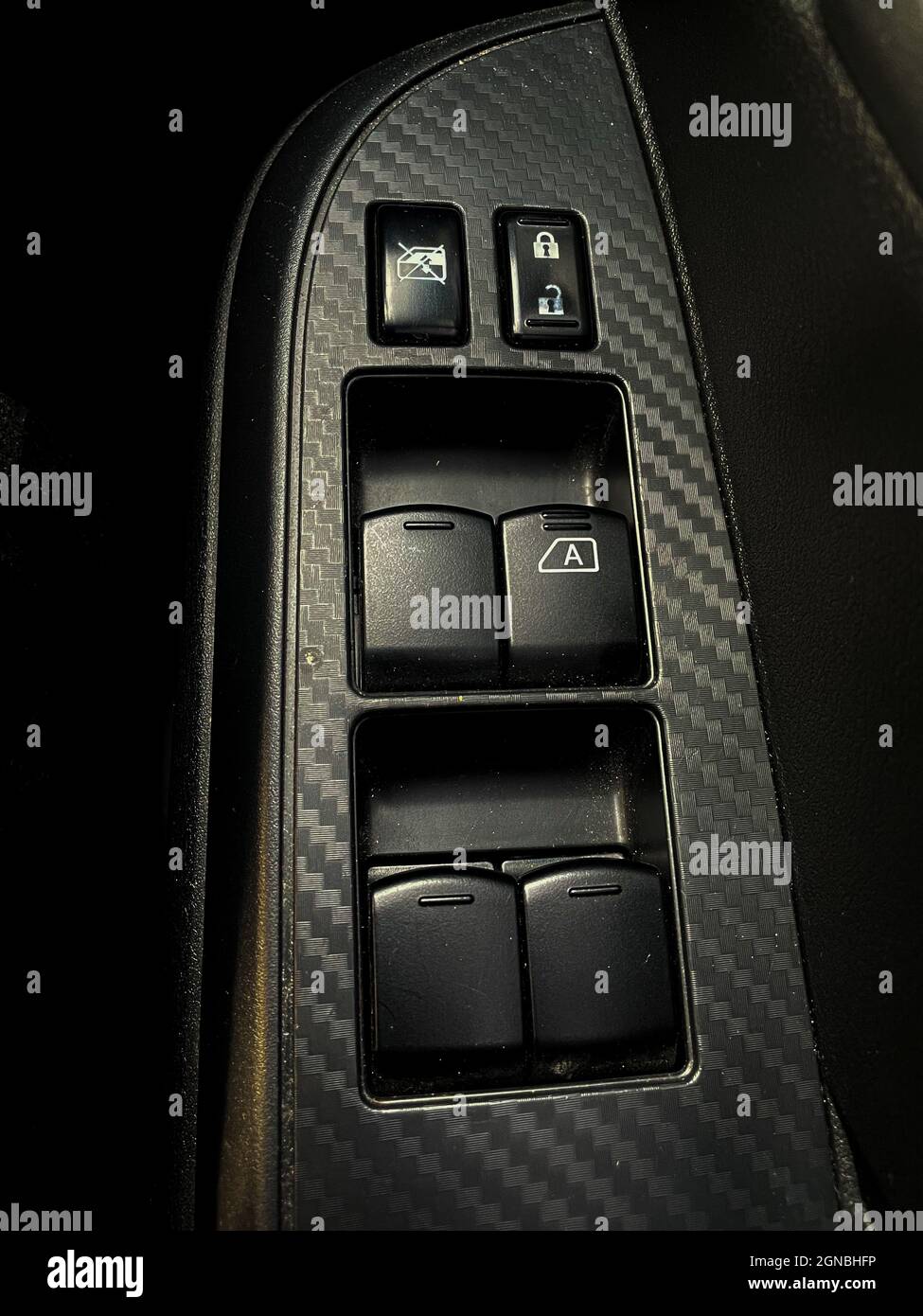 Close up shot inside a car of the buttons panel for controlling the ...