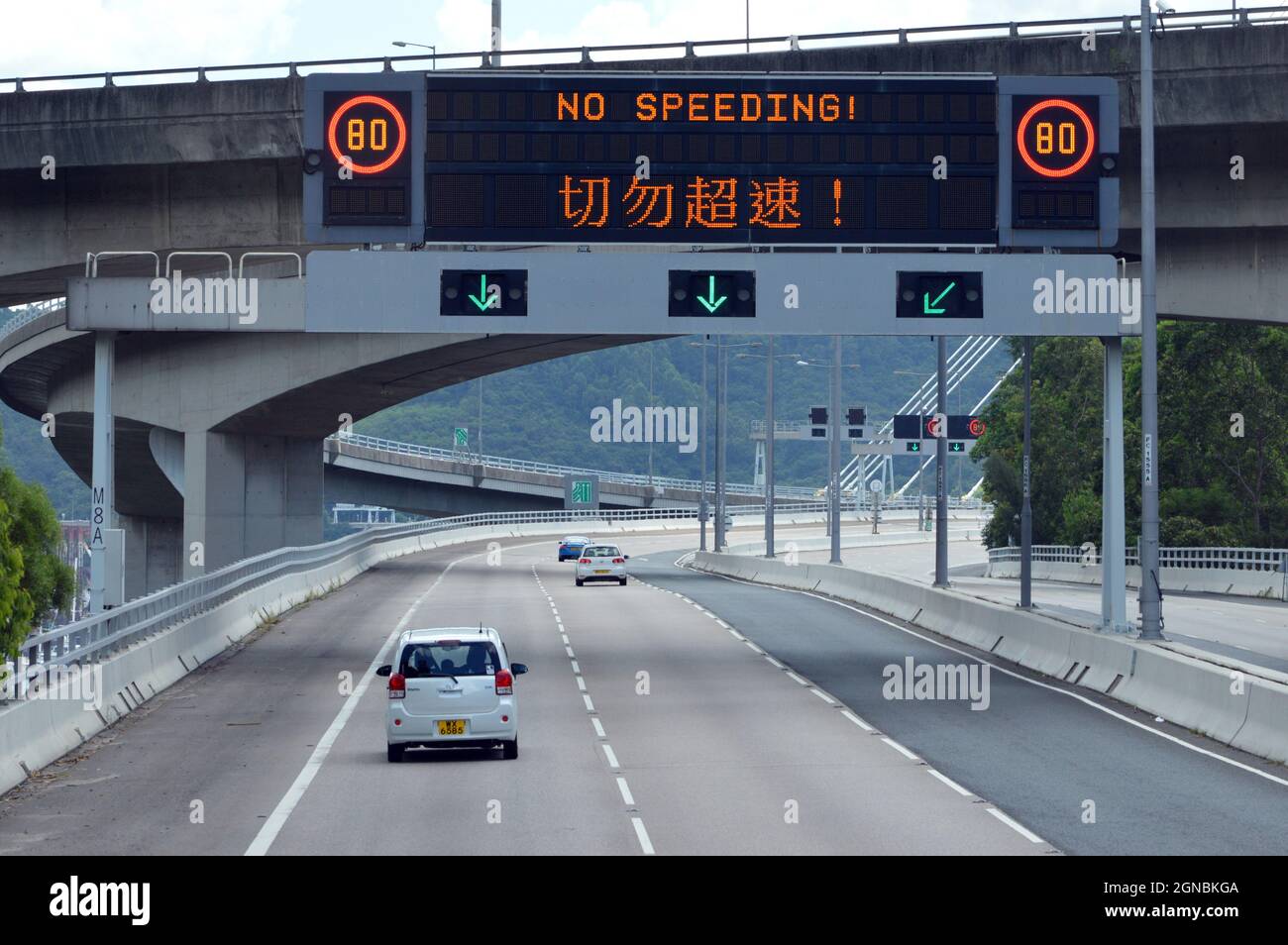 Southbound carriageway of Tsing Long Highway north of Ting Kau Bridge, Hong Kong with variable message sign Stock Photo