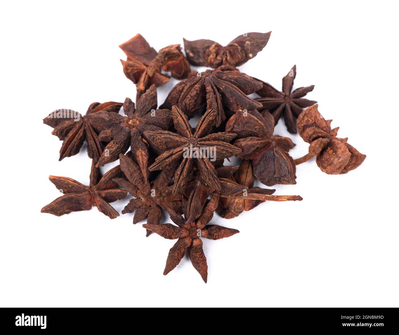 Heap of dry anise stars isolated on white background Stock Photo