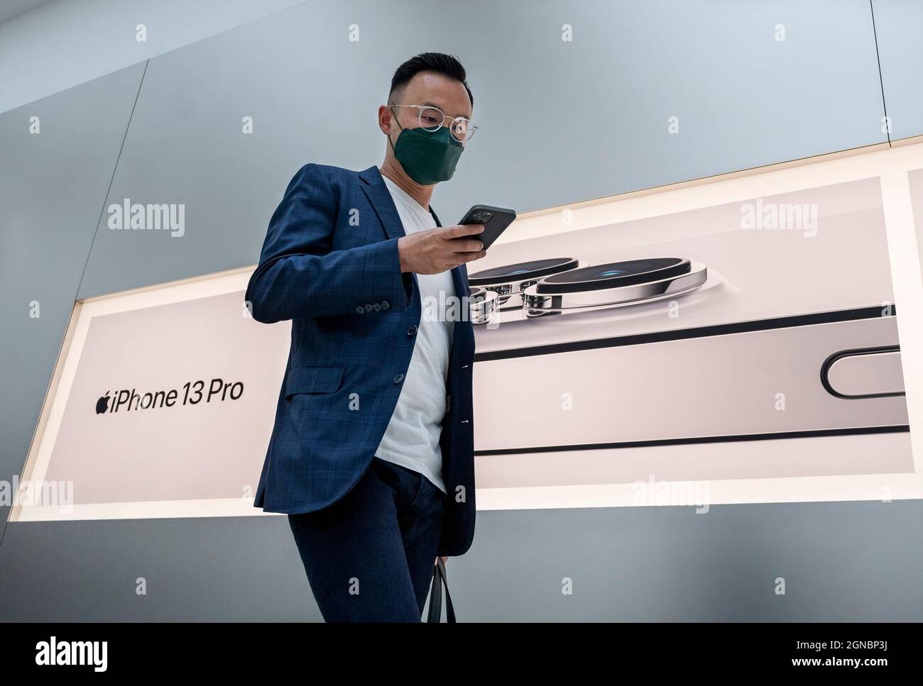 Hong Kong, China. 24th Sep, 2021. A customer walks past the Apple store
